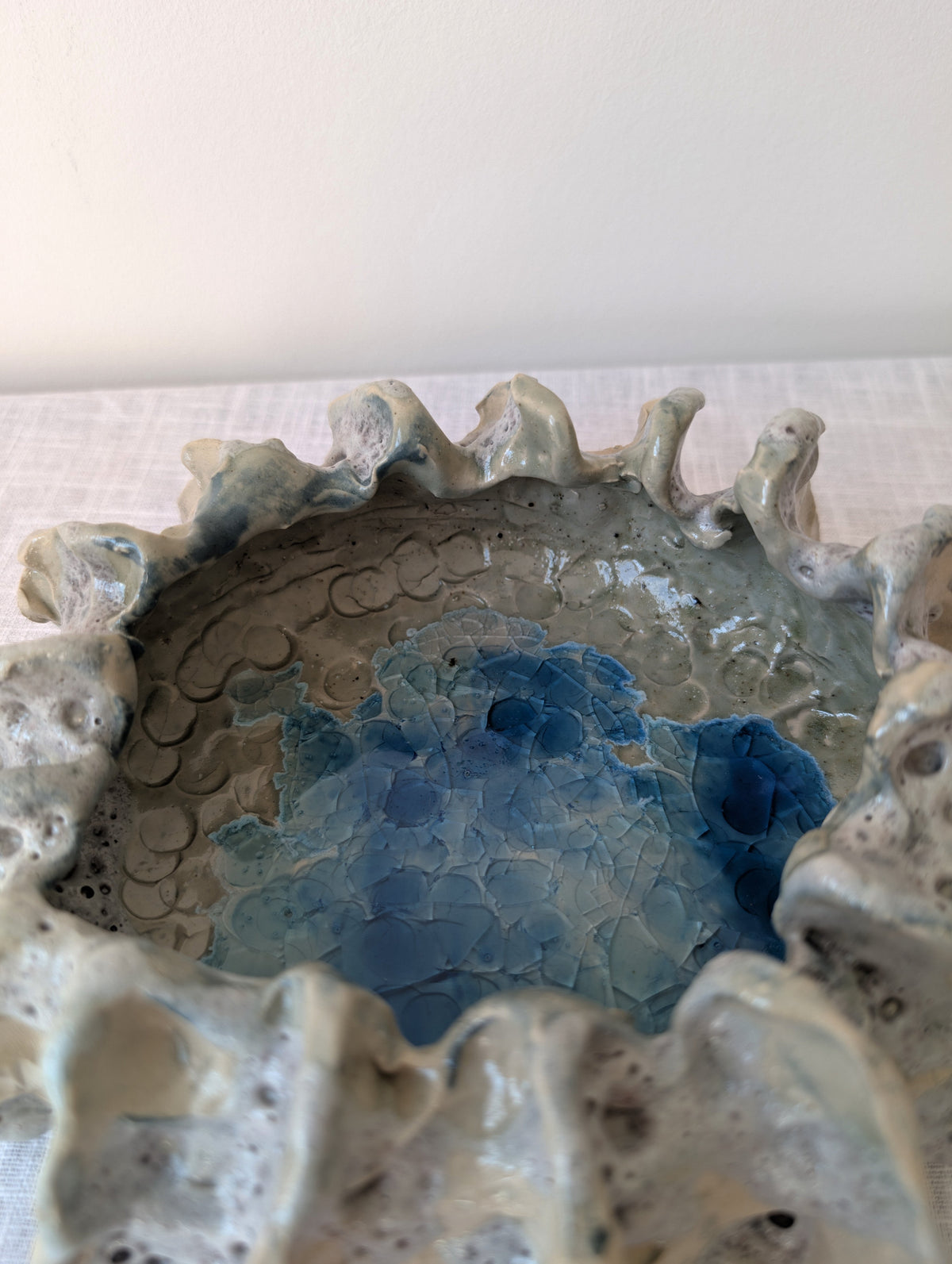 Sculptural Ceramic Bowl with Organic Rim and Blue Glaze, photograph 3