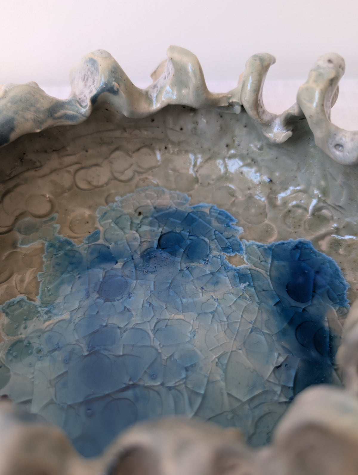Sculptural Ceramic Bowl with Organic Rim and Blue Glaze, photograph 4