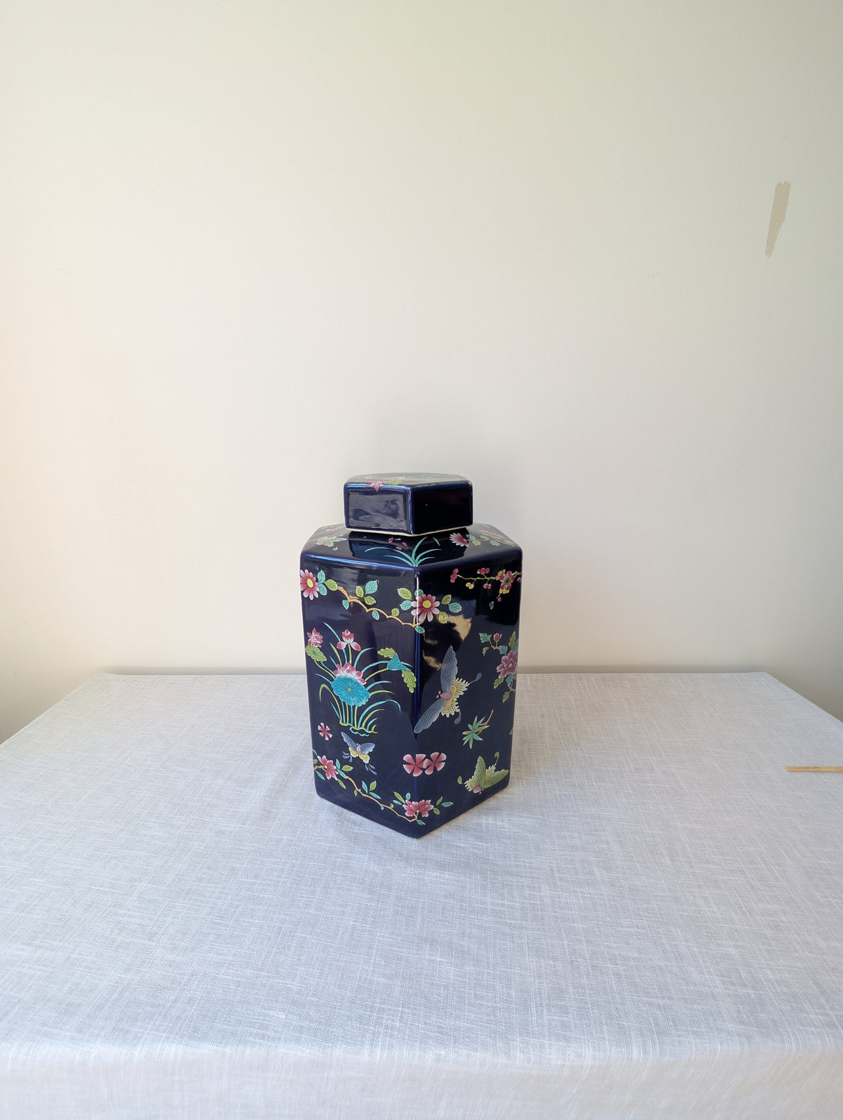 Faceted Cobalt-Blue Lidded Ceramic Jar with Floral Decoration, photograph 1